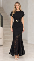 Full front view of model wearing black belted asymmetrical lace mermaid maxi dress
