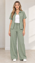 Full front view of model wearing Sage Green short-sleeve shirt and wide-leg drawstring pants two-piece set