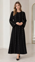 Front view of black pearl embellished long sleeve maxi dress