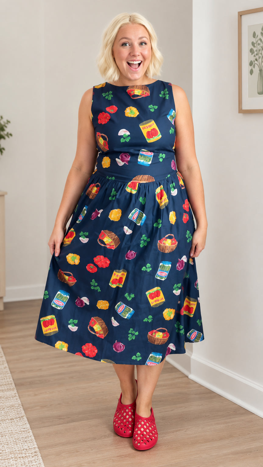 Front view of model wearing Navy Blue vintage market print sleeveless midi dress