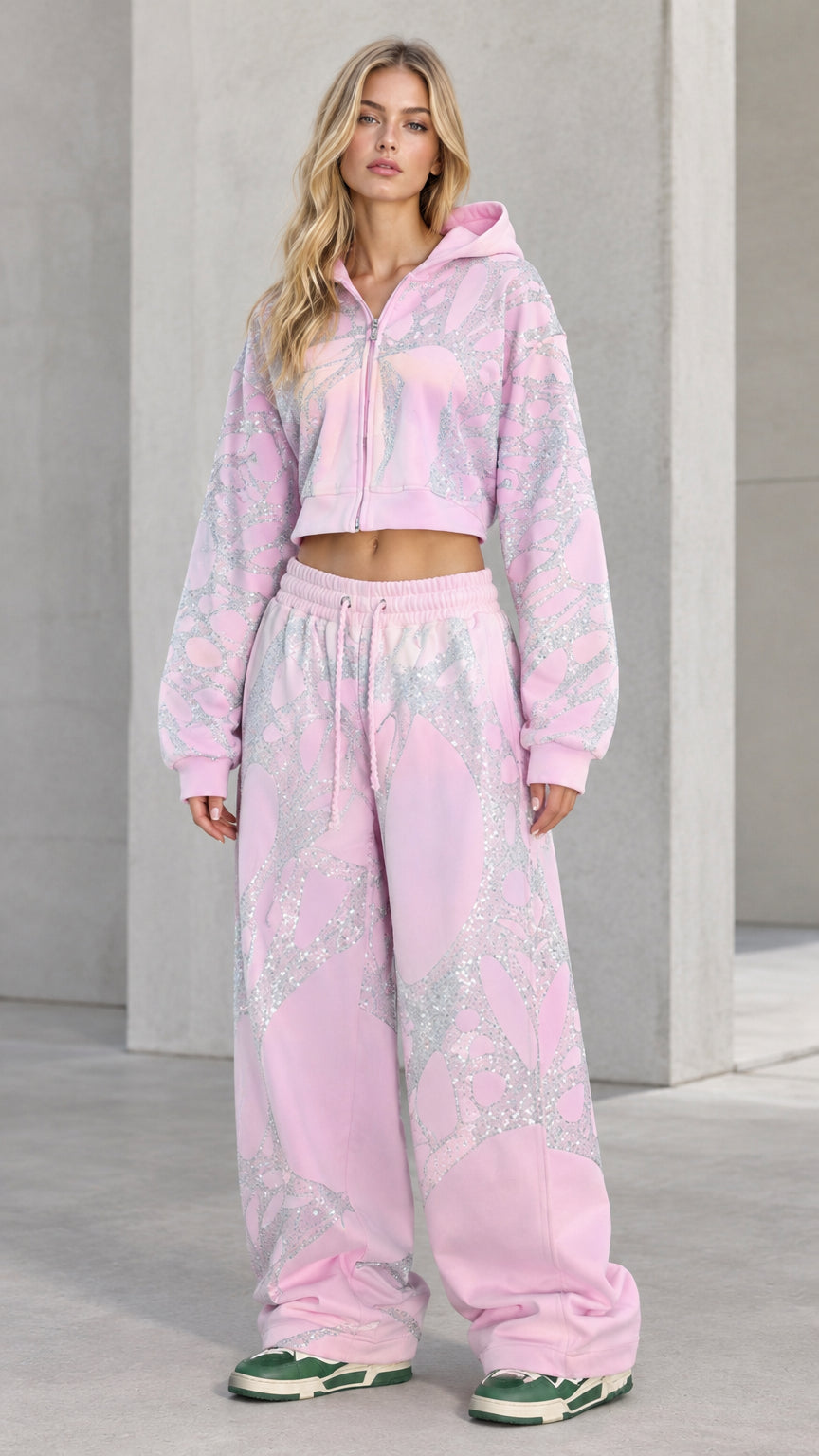 Front view of model wearing Light Pink rhinestone cropped zip hoodie and wide-leg sweatpants set