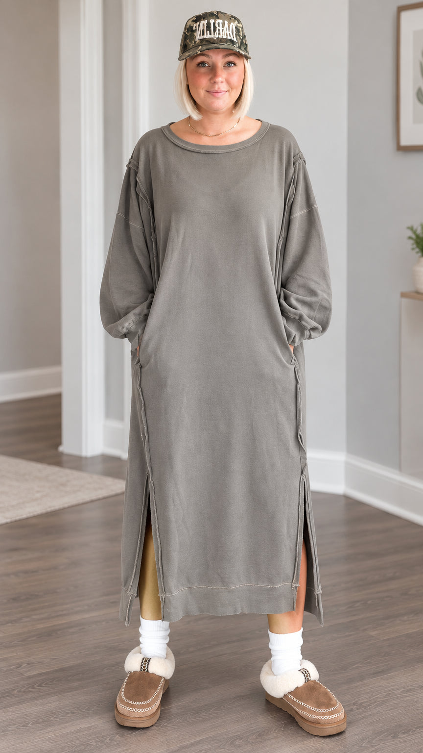 Front full view of a woman wearing the washed olive long sleeve maxi sweatshirt dress with side slits