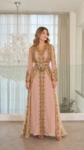 Front full-length view of model wearing dusty pink embroidered Moroccan kaftan evening dress with embellished belt