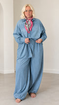 Front full-length view of model wearing the Light Blue relaxed button-down shirt and wide-leg matching pants set