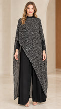 Front full view of black two-piece set featuring shimmering asymmetrical cape and wide-leg pants