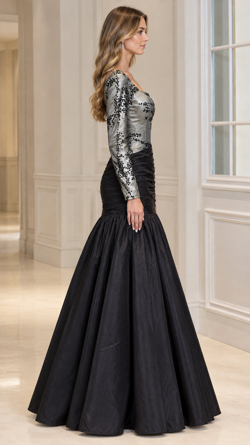 Side profile of black long sleeve formal gown with ruched waist and voluminous skirt