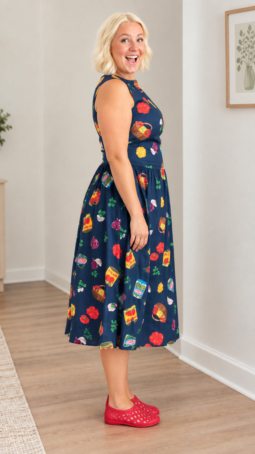 Side view of model showing A-line silhouette of Navy Blue midi dress