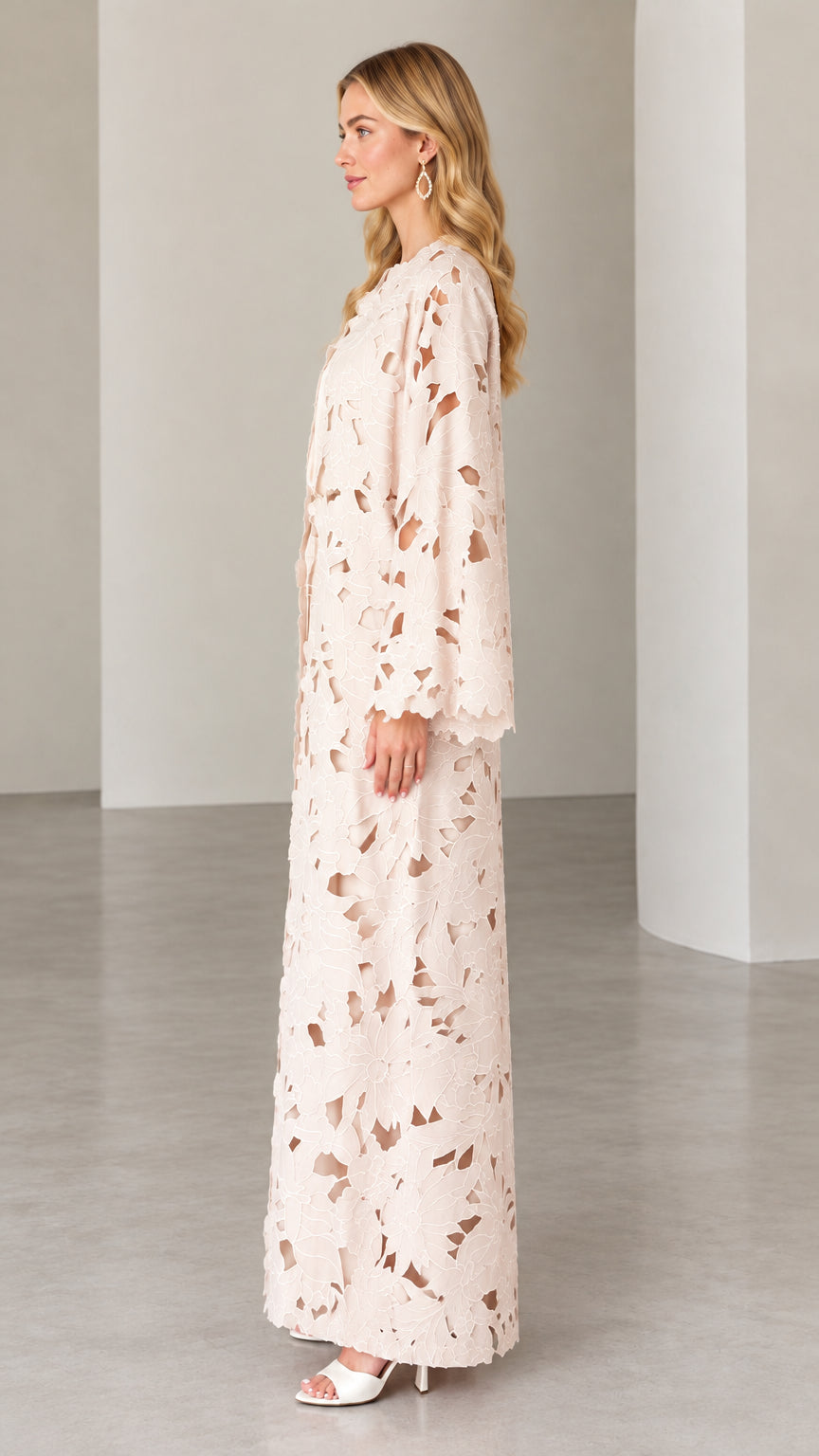 Side profile view of blush pink floral lace maxi dress set