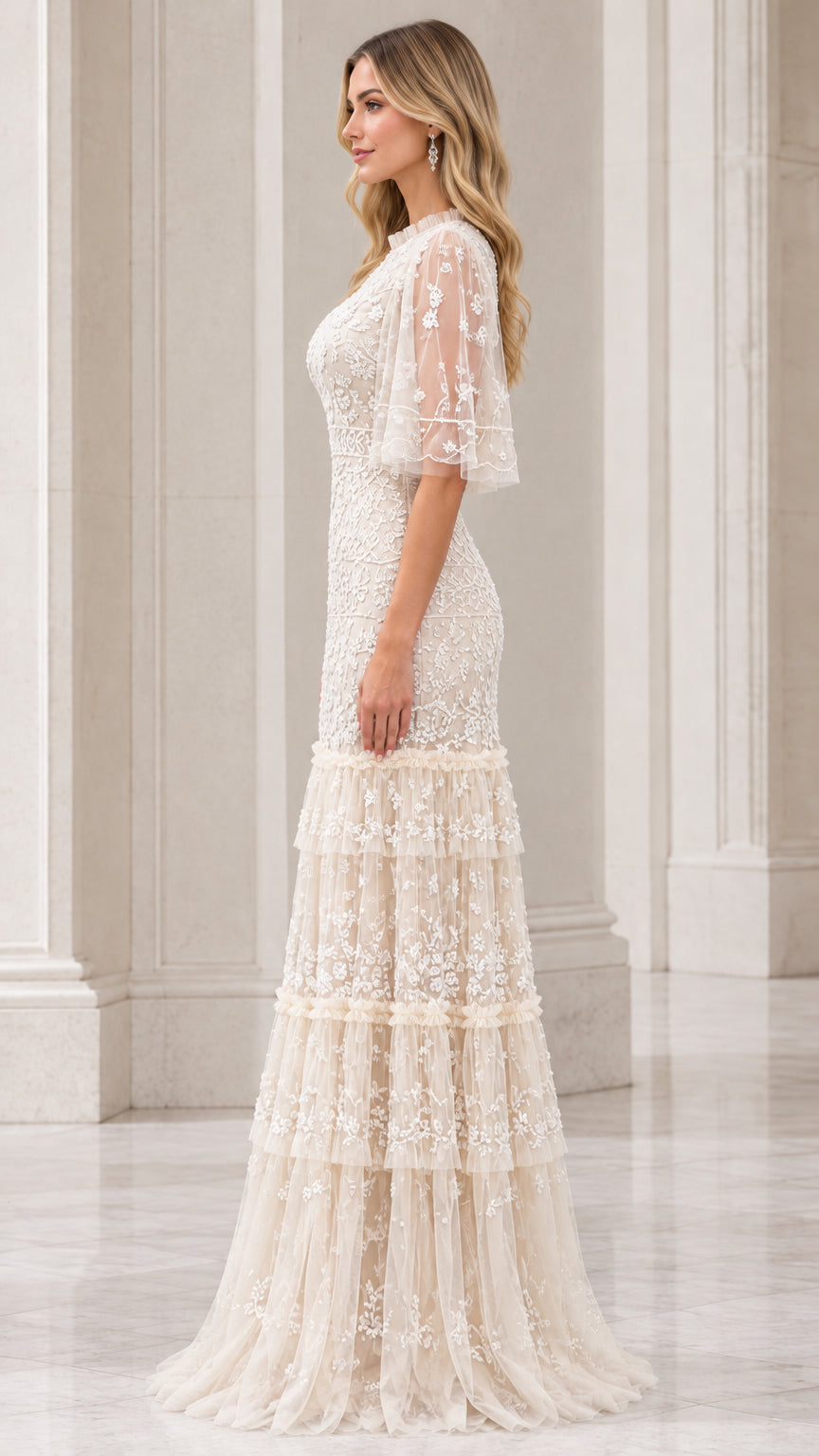 Side profile view of champagne embroidered tiered maxi dress showing silhouette