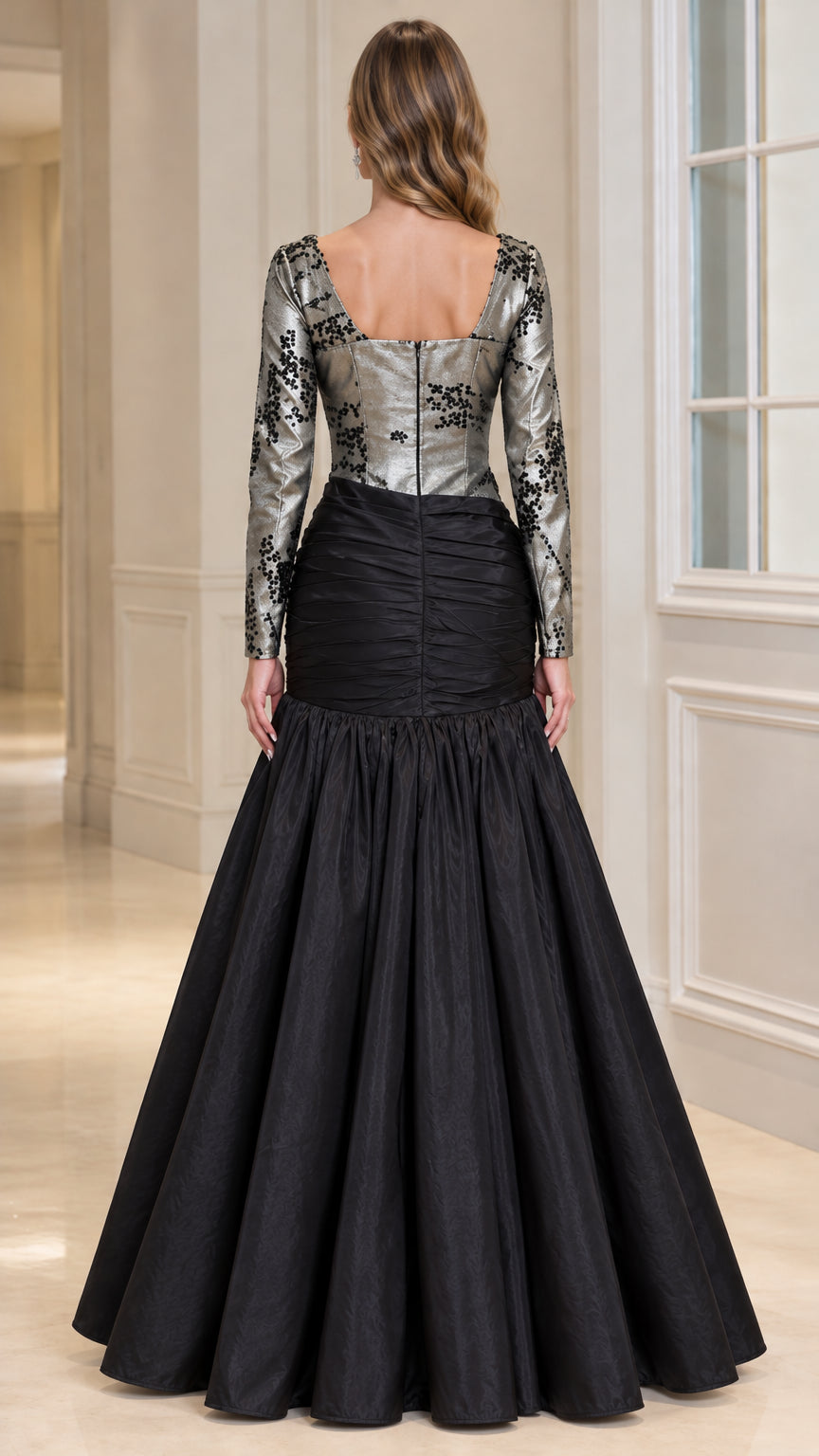 Back view of black and silver evening gown showcasing square neckline and back zipper