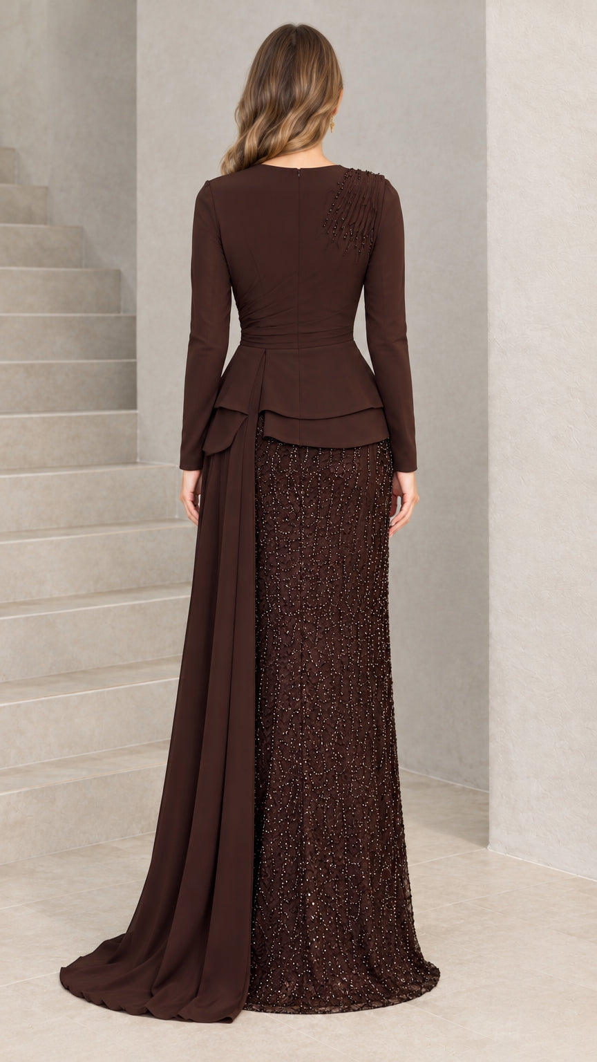 Back view of chocolate brown long sleeve formal gown with cascading drape