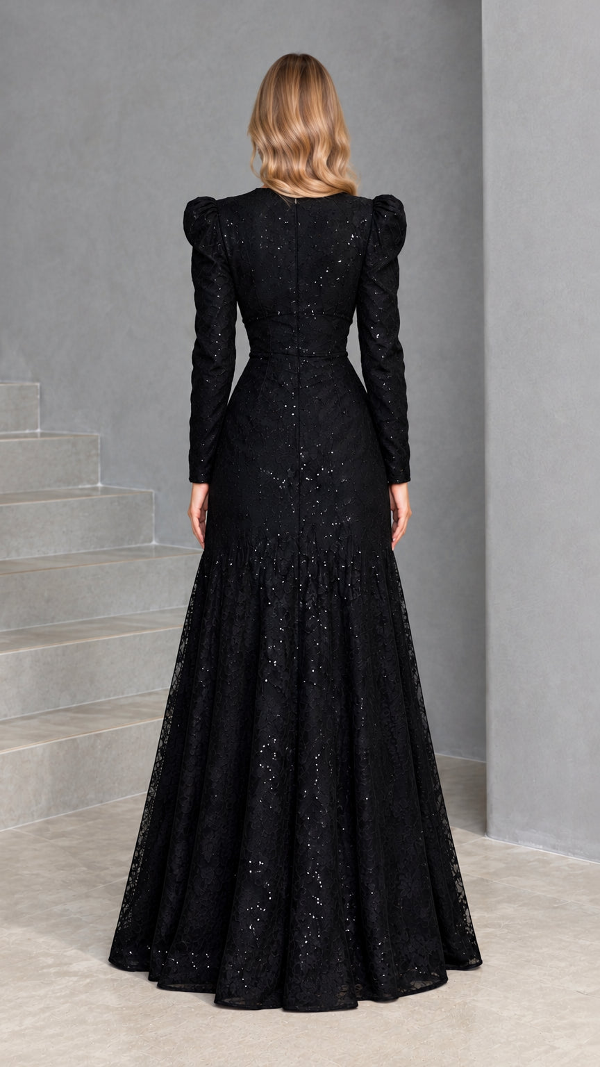 Rear back view of woman wearing black sequin lace evening gown with long sleeves