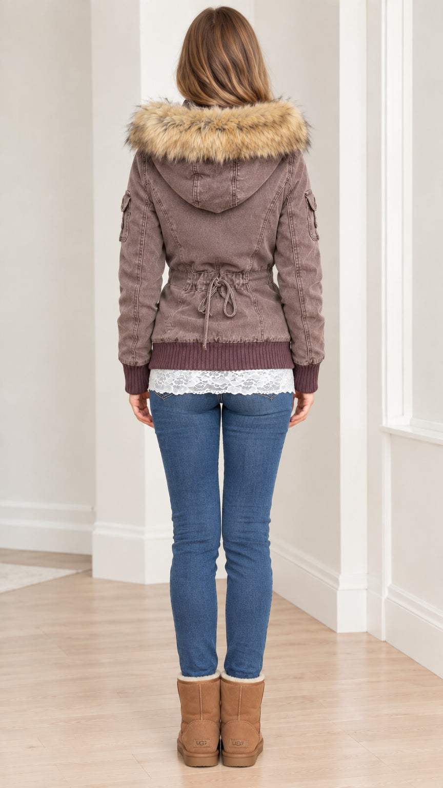 Back view of women's taupe brown parka jacket showing adjustable waist tie and fur hood