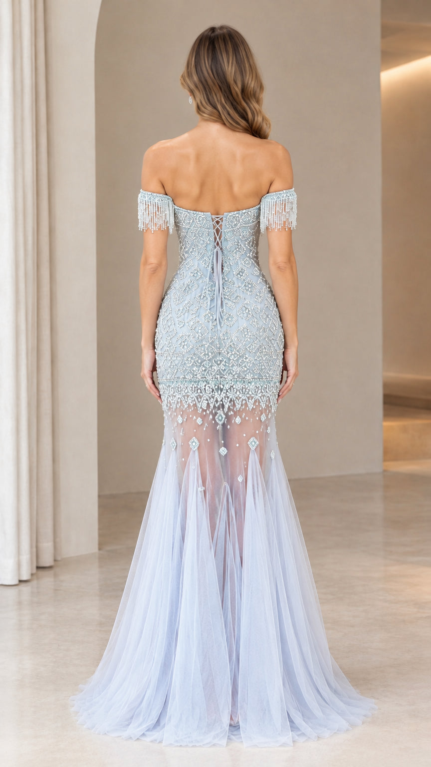 Back view of light blue evening gown with lace-up corset closure and flowing tulle skirt