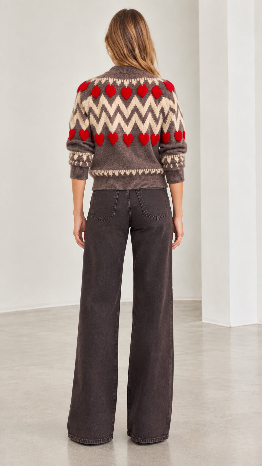 Back view of woman wearing mocha brown chevron heart zip-up knit cardigan