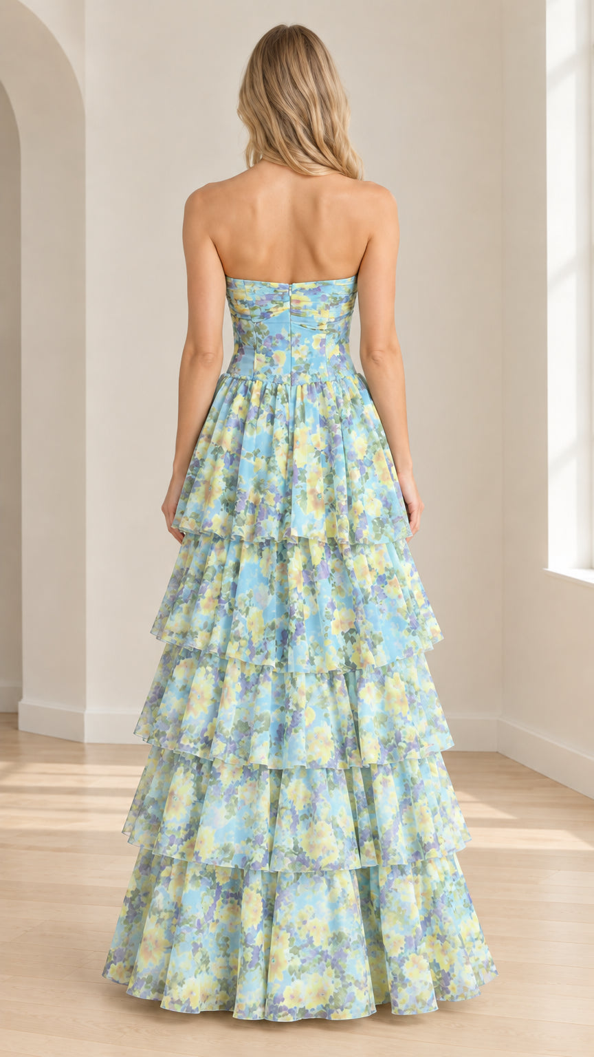 Back view of model wearing sky blue floral strapless tiered maxi dress