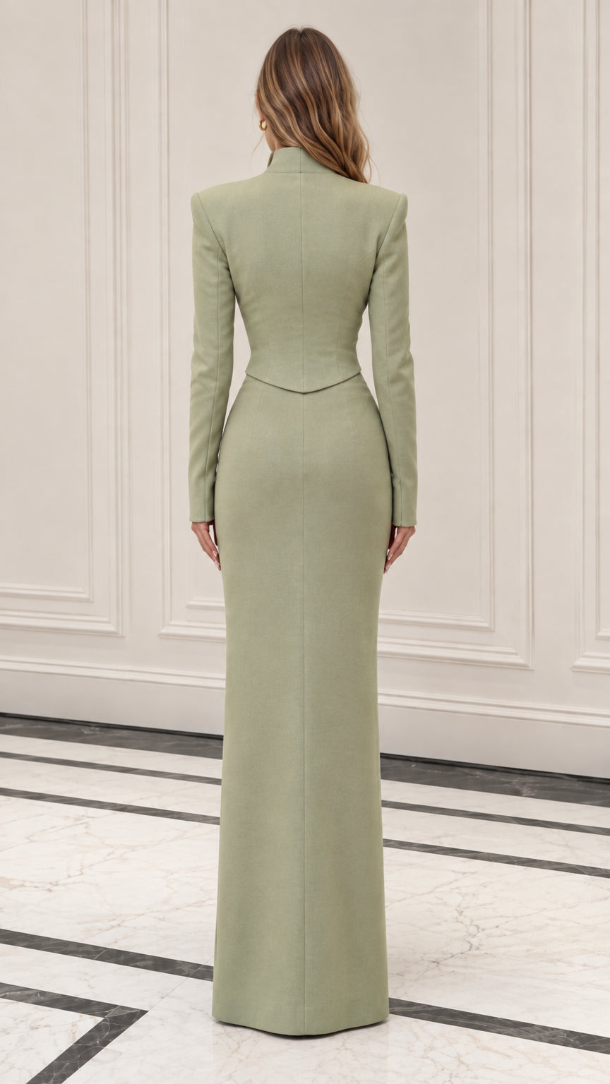 Back view of woman wearing sage green cropped jacket and long column skirt set
