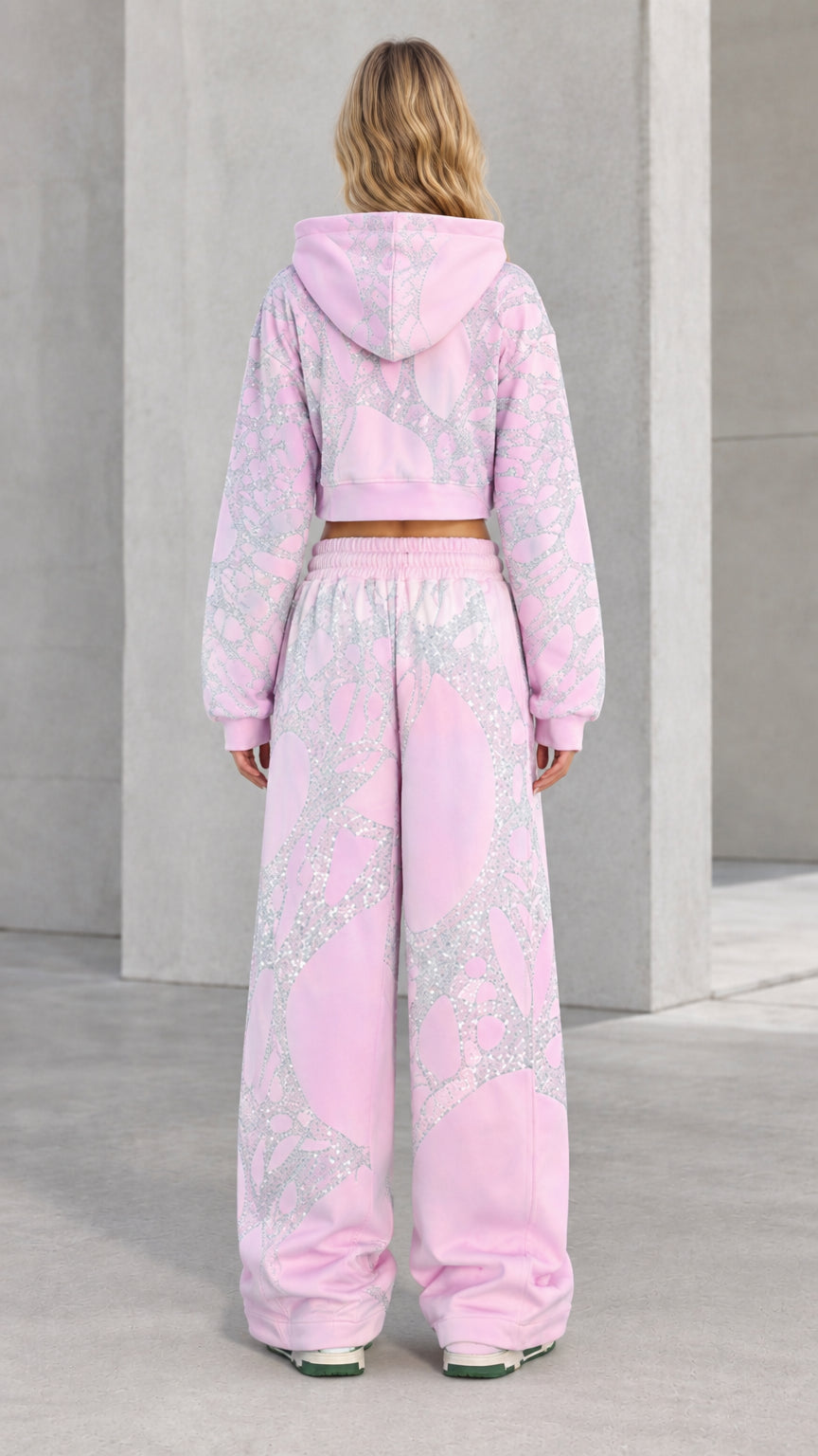 Back view of model in Light Pink cropped hoodie and matching wide-leg pants