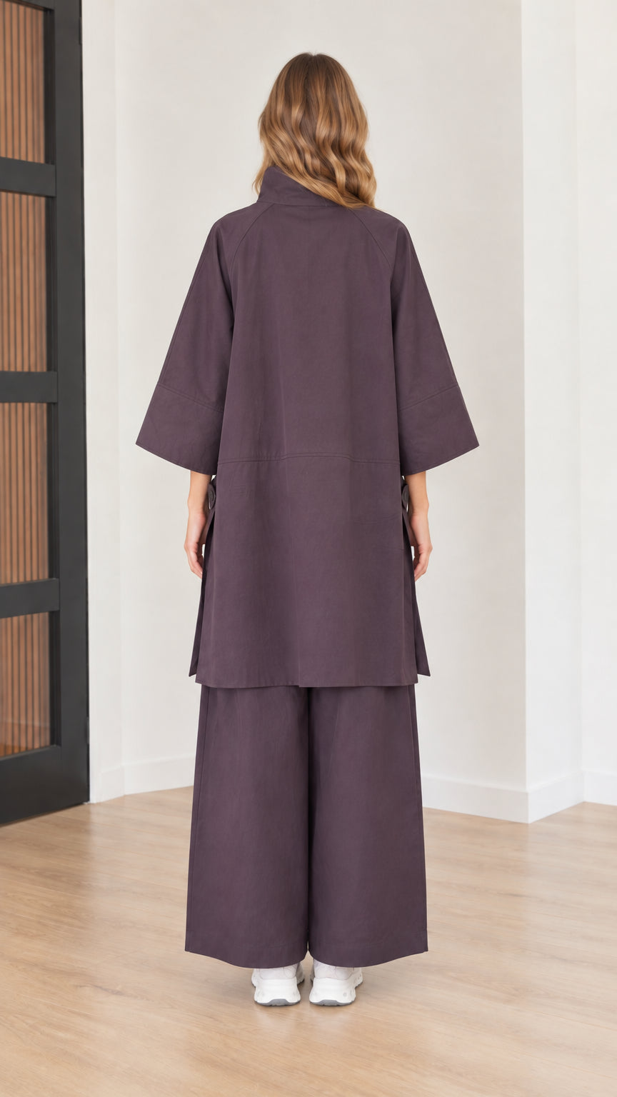 Back view of women's eggplant purple long tunic top and loose wide-leg pants set