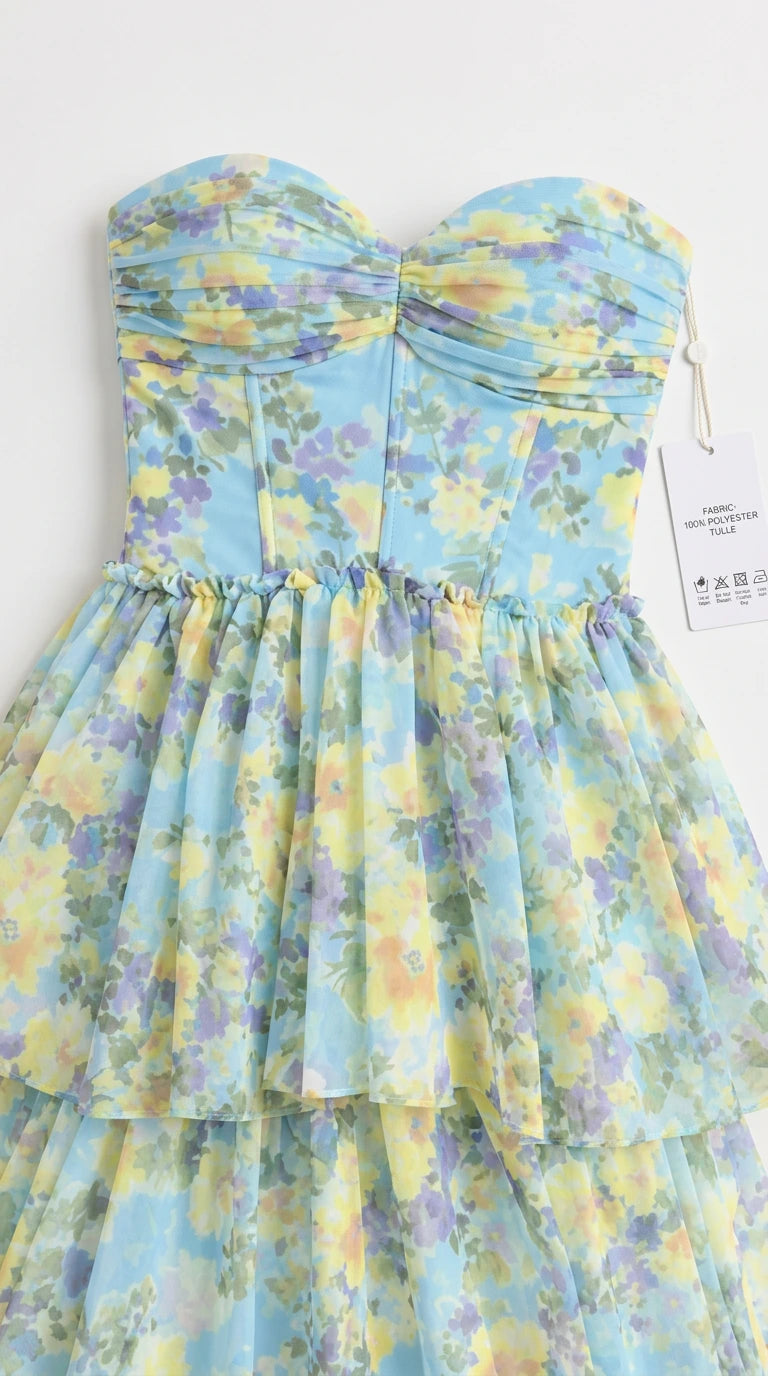 Close-up detail of sweetheart ruched bodice and tulle fabric on sky blue floral dress