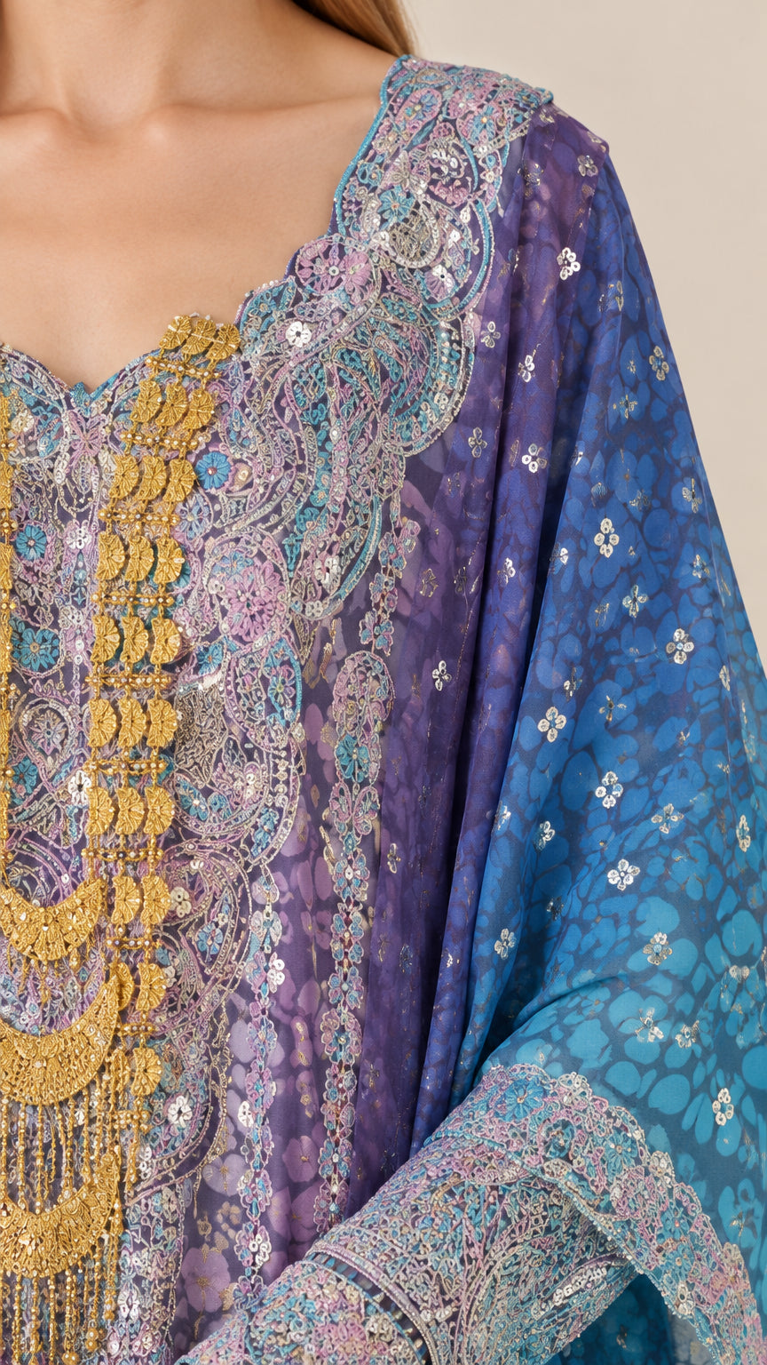 Close-up detail of embellished neckline and printed pattern on kaftan gown