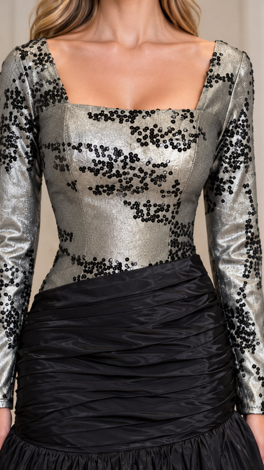 Close-up detail of square neckline and shimmering sequin embellishment on bodice