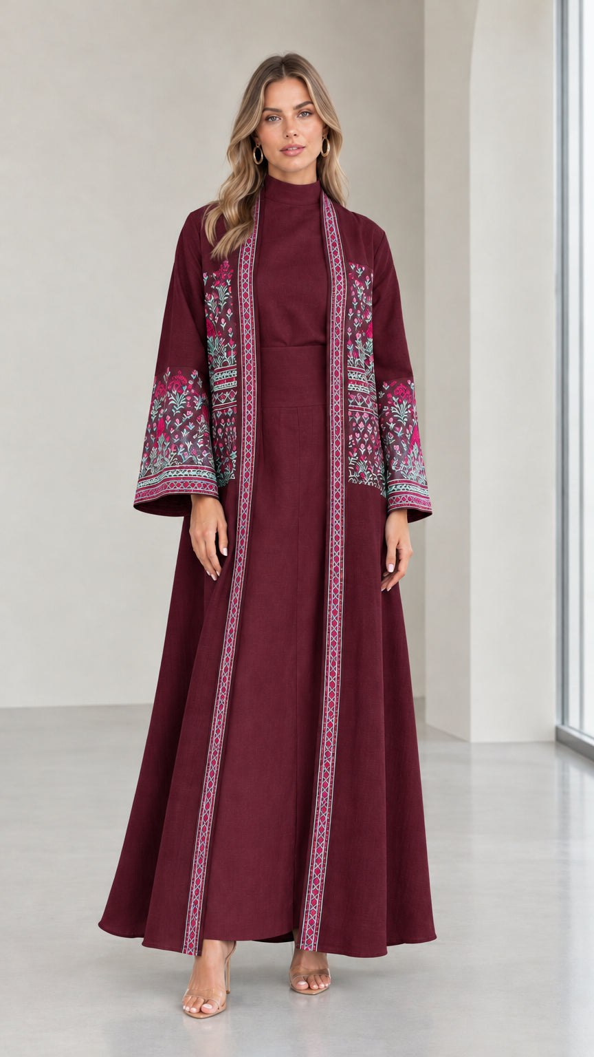 Front view of woman wearing Burgundy embroidered two-piece abaya set